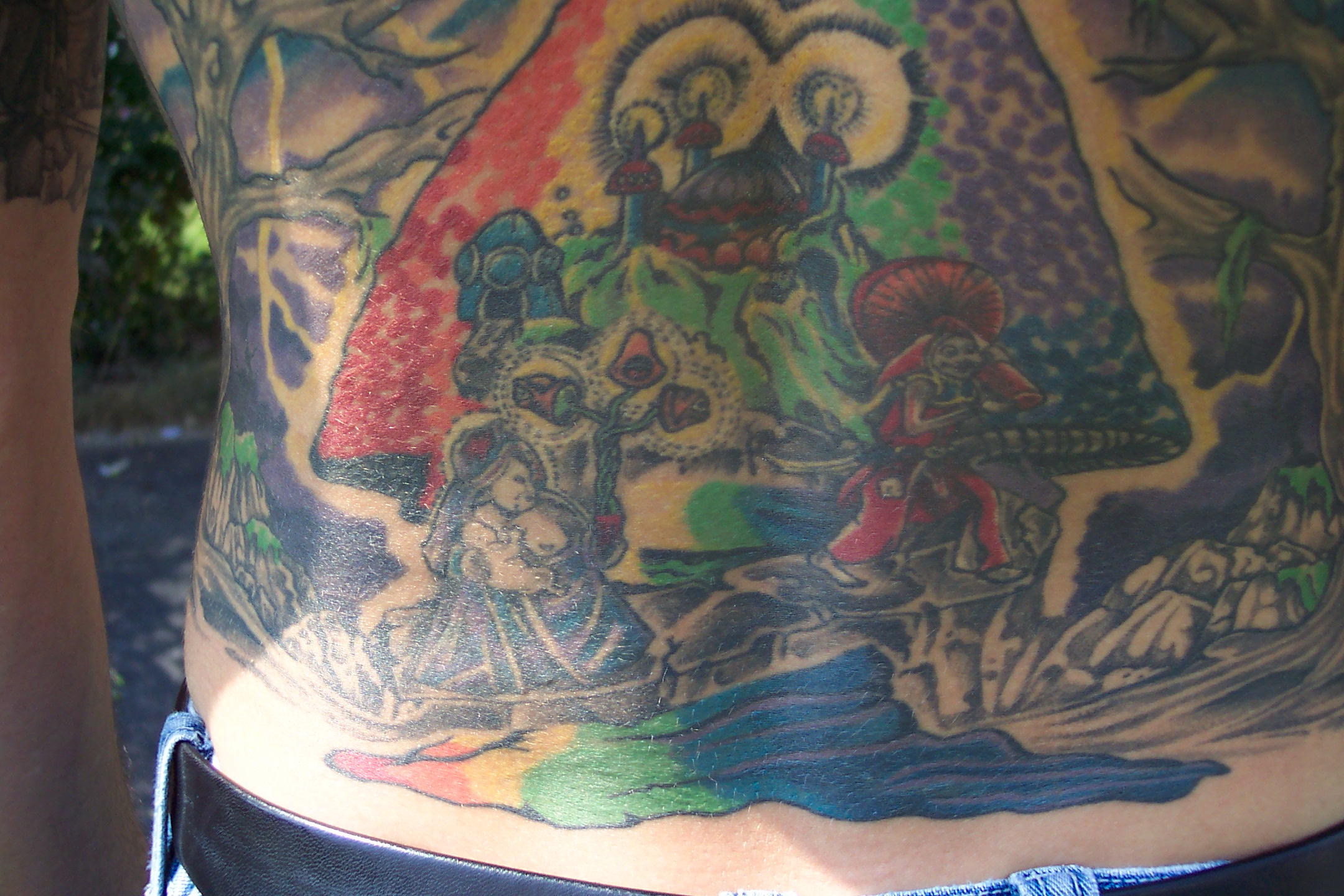 This tattoo covers most of my back.  It is my way of paying tribute to my favorite band.