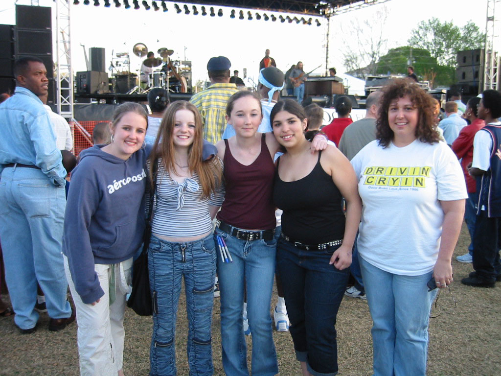 Sue and her daughter, Nikki (right side) with their buds, while the Yonrico Scott band plays onstage.